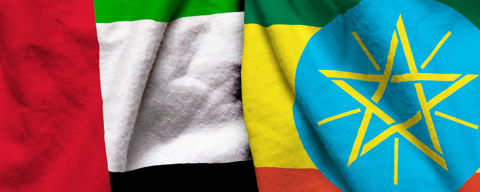 United Arab Emirates and Ethiopia flag on cloth texture