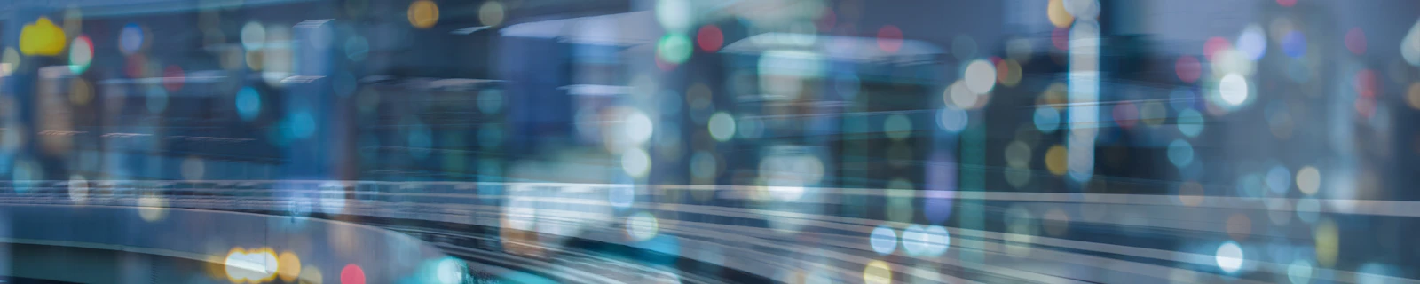 Moving motion train track over blurred bokeh light city downtown